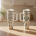 Two tumblers with plant-themed designs on a kitchen counter.