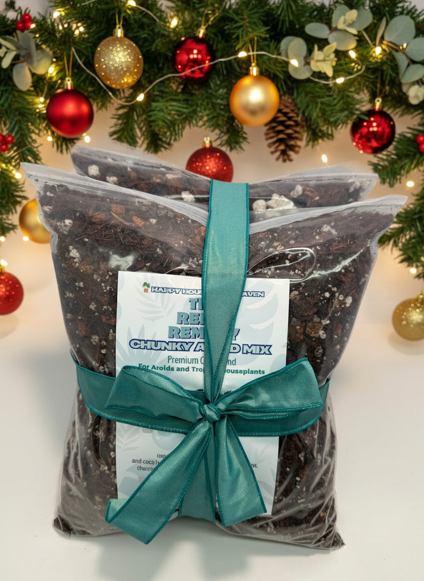 Bag of chunky aged mix with a green ribbon on a white surface