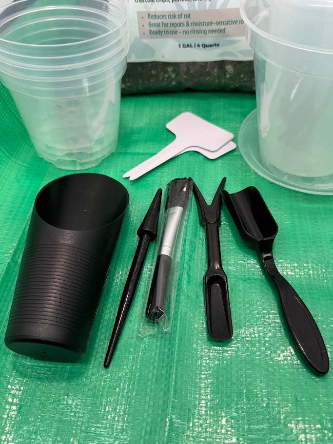 Black tools and containers on a green surface