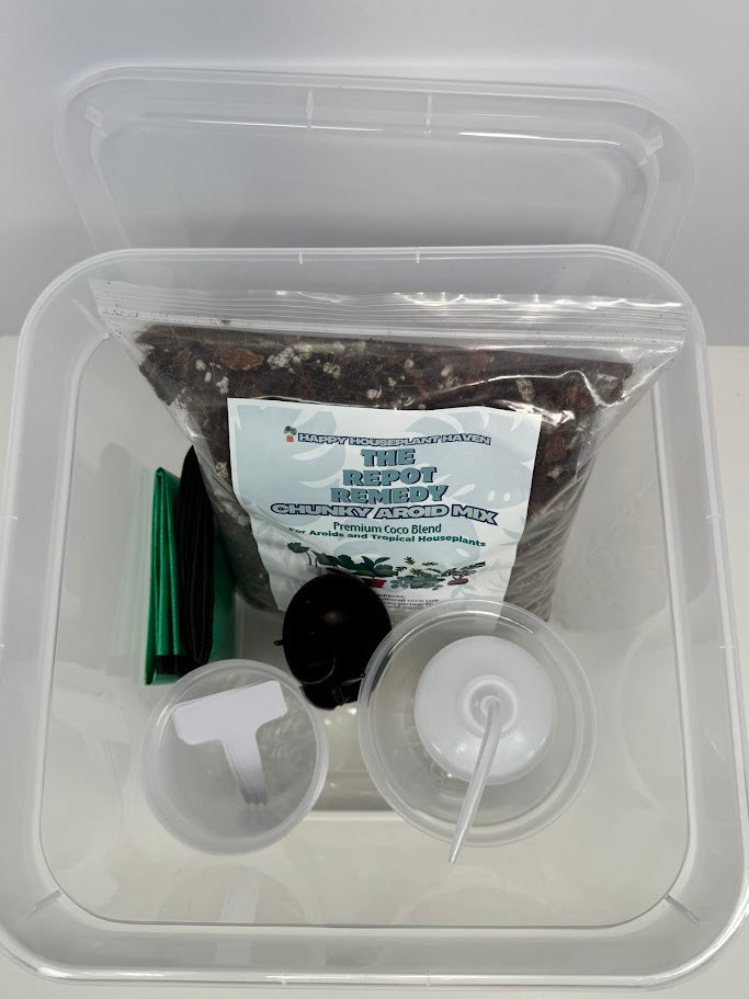 Container with a packet labeled 'The Root Doctor' and gardening tools on a white background
