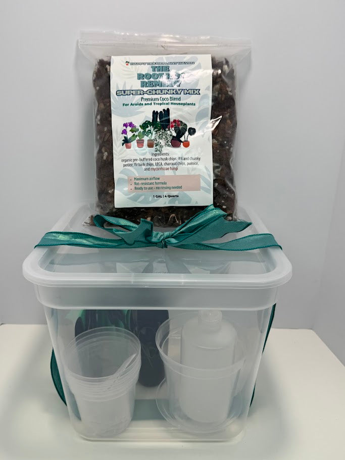 Container with potting mix and small pots on a white background