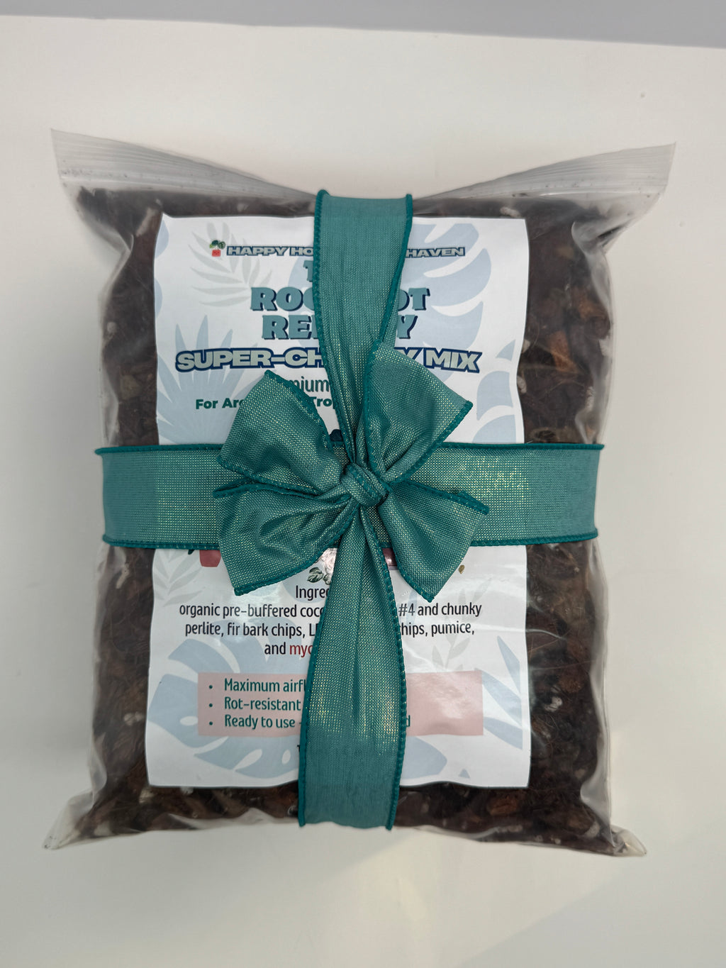 Packaged product with a green ribbon on a white background