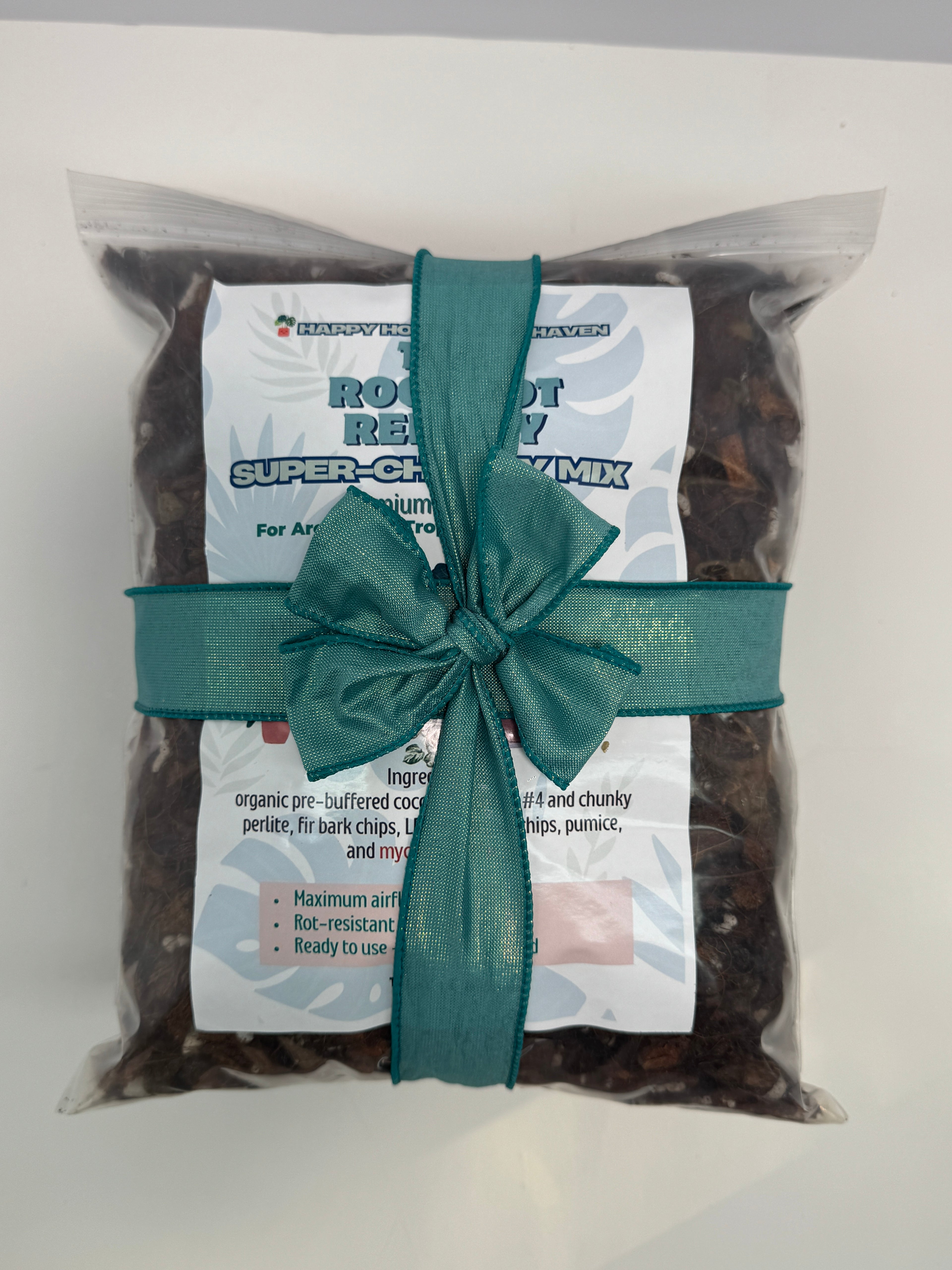 Packaged product with a green ribbon on a white background