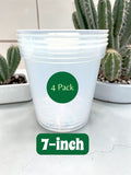 Stack of 7-inch plant pots with a '4 Pack' label, placed on a surface with cacti in the background.