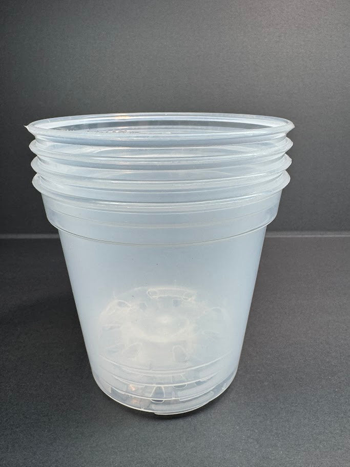Stack of four clear plastic pots 4inch size on a gray background